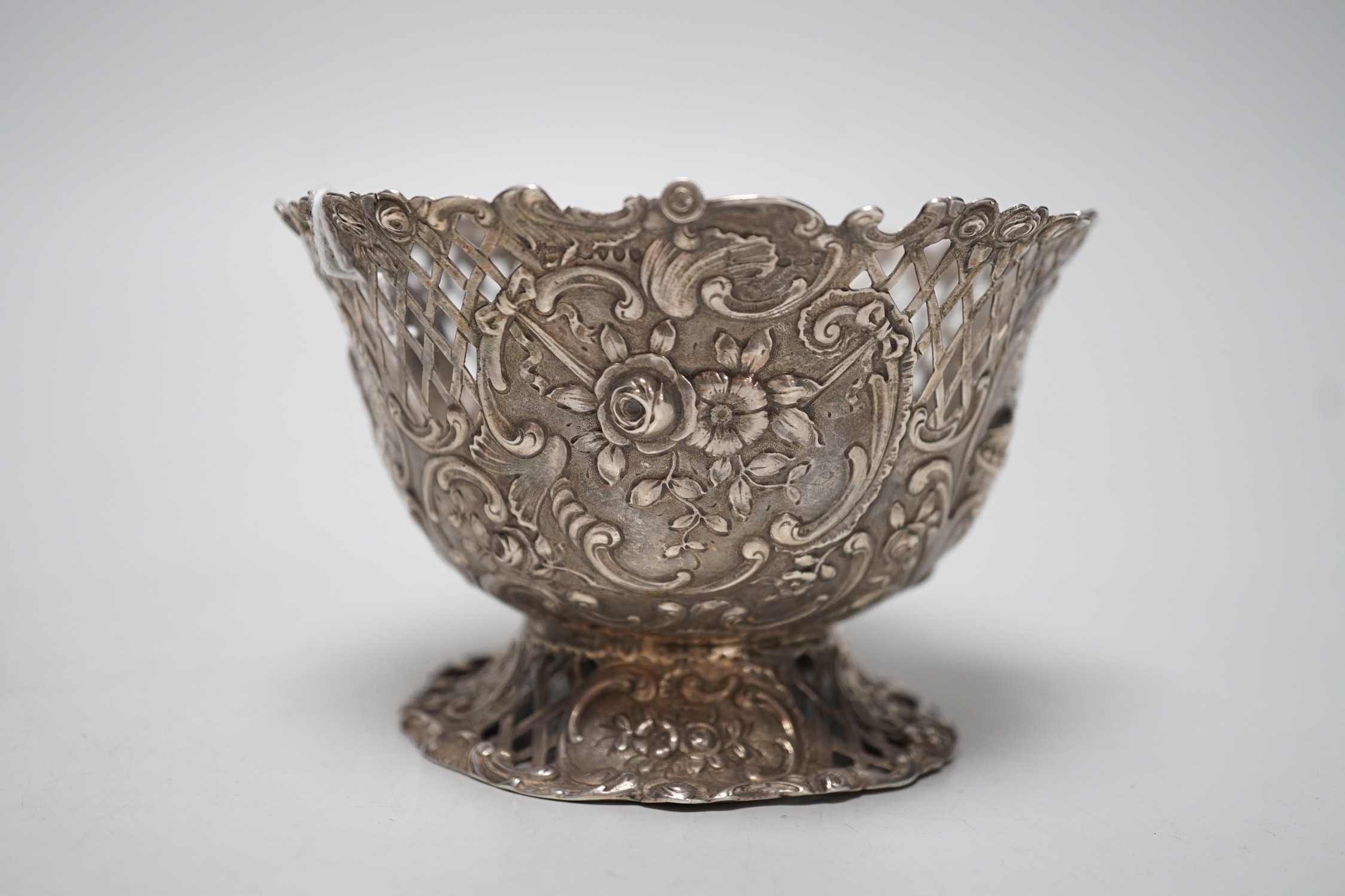 A late 19th century French pierced embossed silver bowl, on circular foot, import marks for William Moreing, London, 1894, diameter 12.2cm, 5.8oz.